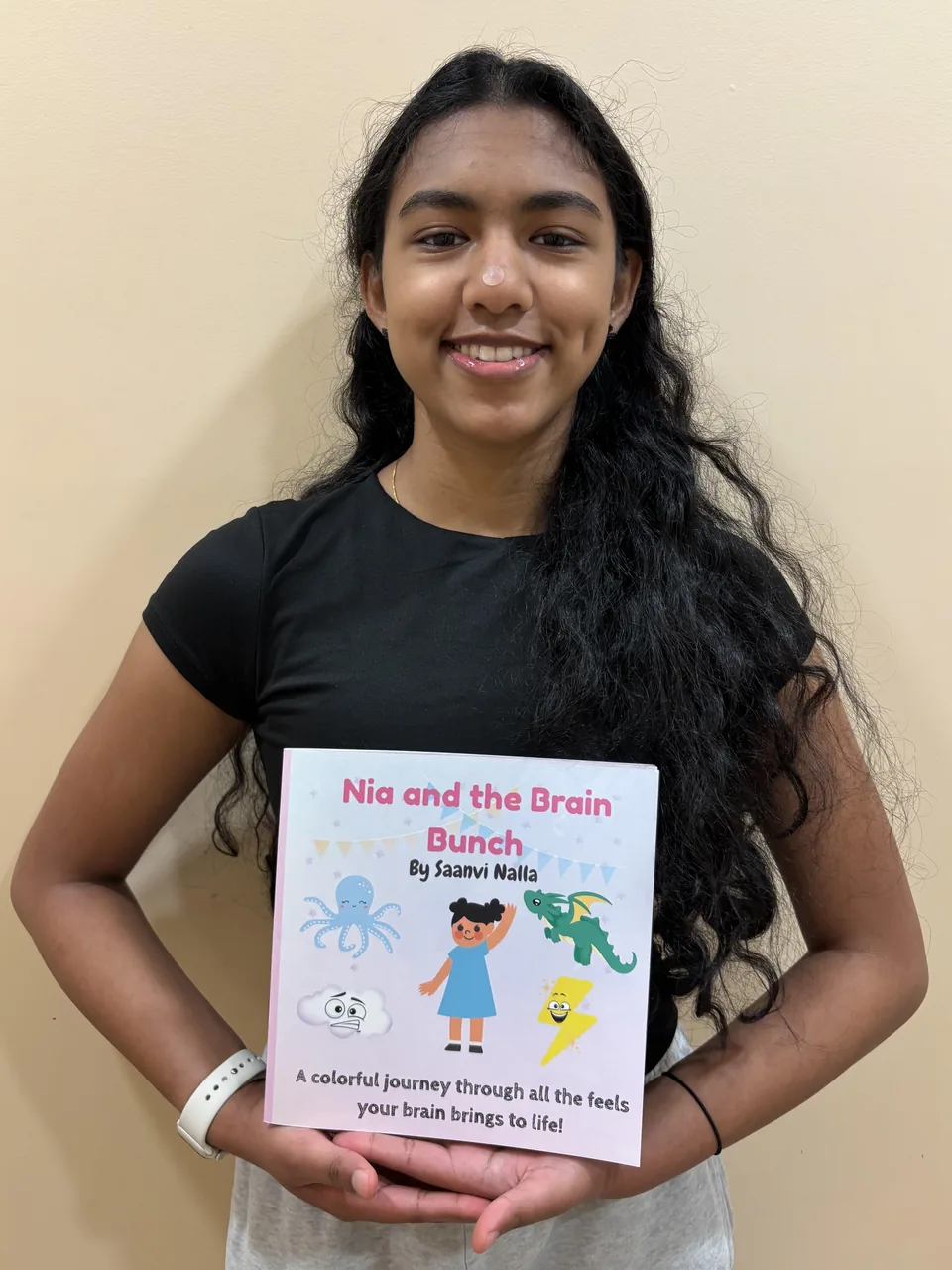 Saanvi holding Nia and the Brain Bunch