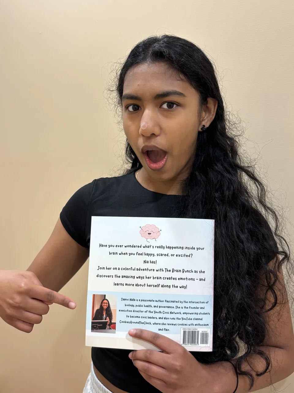 Saanvi sharing a look at her book